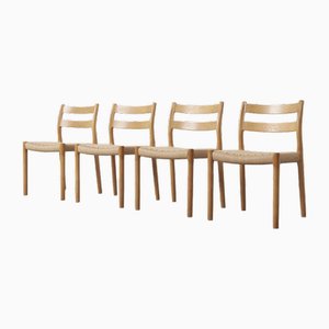Danish Model 84 Oak Papercord Dining Chairs by Niels Otto (N. O.) Møller for J.L. Møllers, 1950s, Set of 4