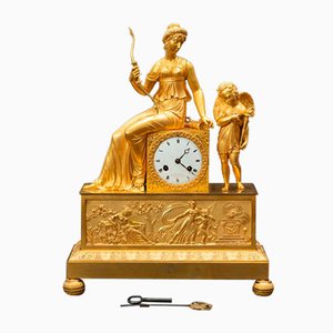 Antique French Empire Clock in Chiseled Golden Bronze