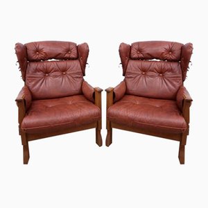 Sillones Mid-Century de cuero. Juego de 2