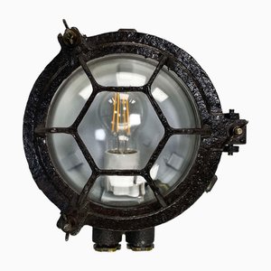 Lámpara de pared circular de hierro fundido negro con vidrio transparente