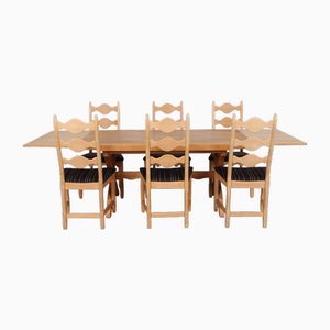 Vintage Dining Room Table in Oak with Crossed Legs and Extendable Plates by Henning Kjærnulf, 1960s, Set of 7