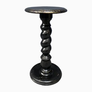 Tavolino in legno nero con base intrecciata