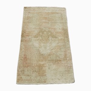 Tappeto vintage beige sovratinto