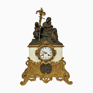 Orologio in bronzo e marmo raffigurante una Madonna, un Bambino e San Giovanni Battista, inizio XX secolo