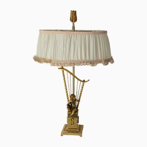 Mid-Century French Brass Table Lamp with Putti Reading in Front of a Harp, 1960s
