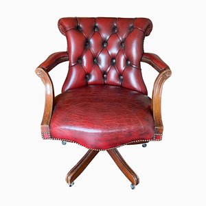 Classic Chesterfield Revolving Captain's Chair in Oxblood Leather with Brass Details, 1970s