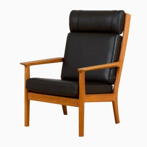 Butaca Ge 265 de roble y cuero negro de Hans J. Wegner para Getama, Dinamarca, años 70