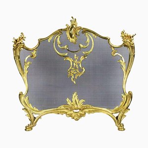 Pantalla de chimenea estilo Louis Xv en bronce dorado con malla protectora de metal