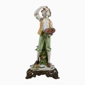 Statuetta da bambino in porcellana con base in ottone di Triade, anni '50