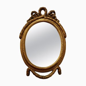 Espejo de pared rococó pequeño oval dorado, década de 1880