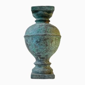 Portapiante antico a colonna in bronzo patinato
