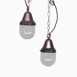 Lampade a sospensione piccole industriali in ottone e vetro trasparente, anni '30, set di 2