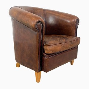 Club chair vintage in pelle di pecora scura