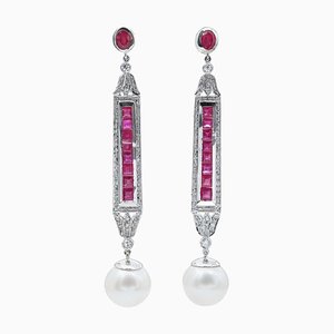 South-Sea Pearls, Rubies, Diamonds, Platinum Earrings. 1960s, Set of 2