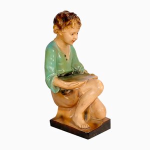 Figura di bambino inginocchiato in ceramica, anni '30
