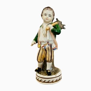 Figura continental de porcelana, década de 1900