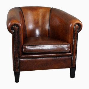 Sheepskin Club Chair with Black Piping and Decorative Rivets