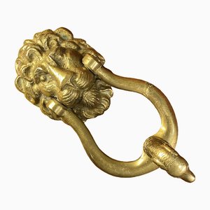 Aldaba zoomorfa antigua de bronce