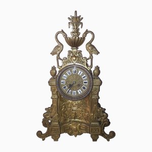 Reloj vintage de bronce, década de 1890