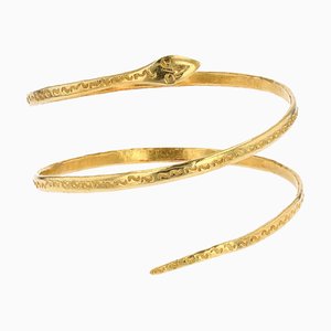 Brazalete con forma de serpiente de oro amarillo de 18 kt, años 60
