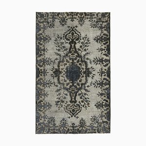 Tapis gris surteint