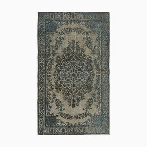 Tapis gris surteint