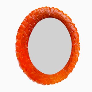 Espejo ovalado de vidrio acrílico naranja con retroiluminación atribuido a Hillebrand, años 70