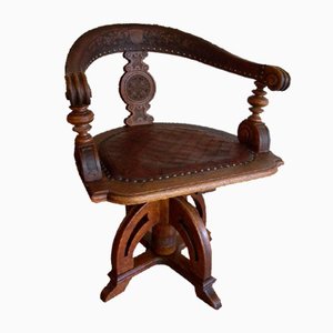 Antique Swivel Chair in Leather