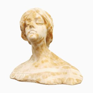 Busto de mujer con cabeza y hombros de alabastro y mármol, década de 1890