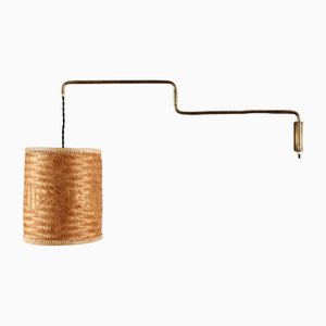 Flexible Wall Light in Brass and Cane in the style of Paavo Tynell, Denmark, 1950s