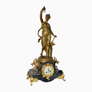 Reloj de repisa vintage de mármol y bronce
