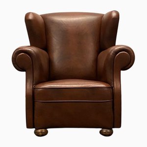 Poltrona Wingback vintage in stile Chesterfield