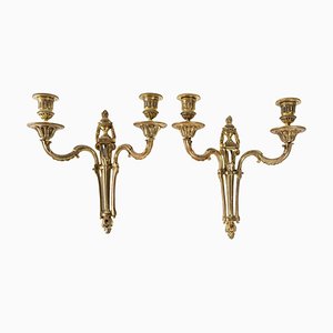 Lámparas de pared estilo Luis XVI de bronce dorado. Juego de 2