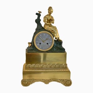 Reloj de repisa con figura de bronce dorado al fuego, 1830