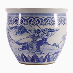 Pecera de porcelana azul blanca decorada con jinetes Qing