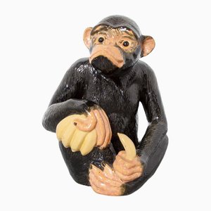 Escultura de mono de cerámica con plátanos