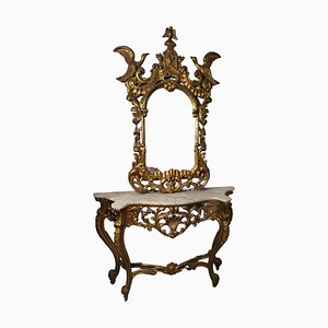 Consola, siglo XIX con tapa de mármol y espejo tallado con pan de oro, España. Juego de 2