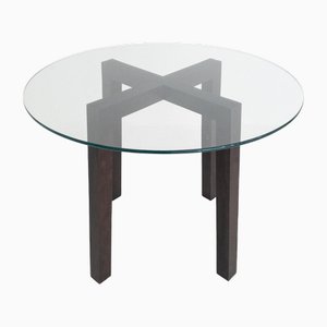 Mesa de comedor redonda de madera con tablero de vidrio