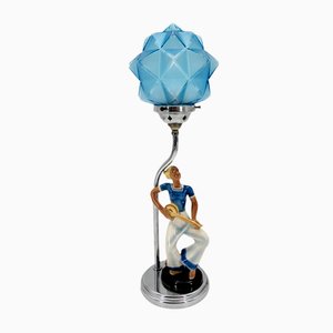 Art Deco Tischlampe mit glasierter Keramik Figur von Matrosine mit sternförmigem Lampenglas in Blau, Deutschland, 1930er