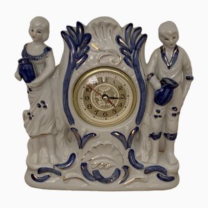 Reloj de chimenea vintage de cuarzo con figura de porcelana, años 40