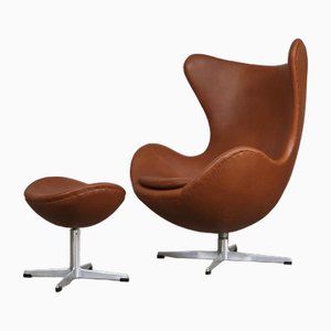 Egg Chair con poggiapiedi in pelle marrone di Arne Jacobsen per Fritz Hansen, anni '60, set di 2