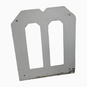 Letra M de hierro, años 50