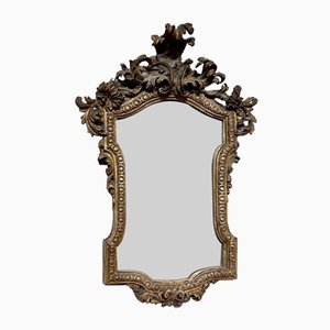 Espejo antiguo de madera tallada y dorada