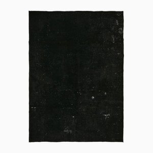 Grand tapis noir surteint