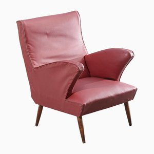 Red Leather Armchair with Flared Wooden Feet. 1950s