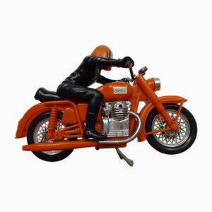 Motocicleta vintage grande de plástico naranja, años 70