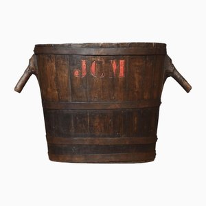 Oval-Shaped Log Bin with Oak Frame and Iron Bands