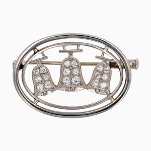 Broche de campanas ovaladas de diamantes y oro blanco de 18 kt, años 30