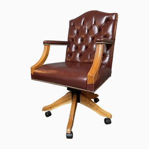 Buttoned Back Leather Swivel Chair in the style of Gainsborough