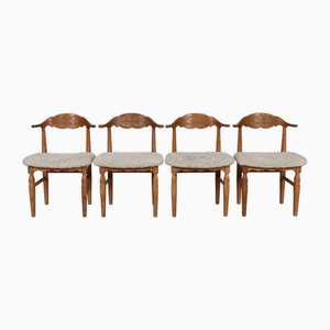 Danish Dining Chairs in Oak & Sheepskin attributed to Henning Kjærnulf for Nyrup, 1970s, Set of 4